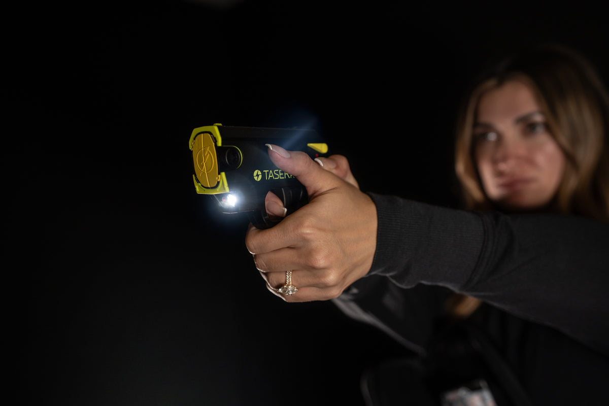 Paige Roux demonstrating the TASER Pulse 2