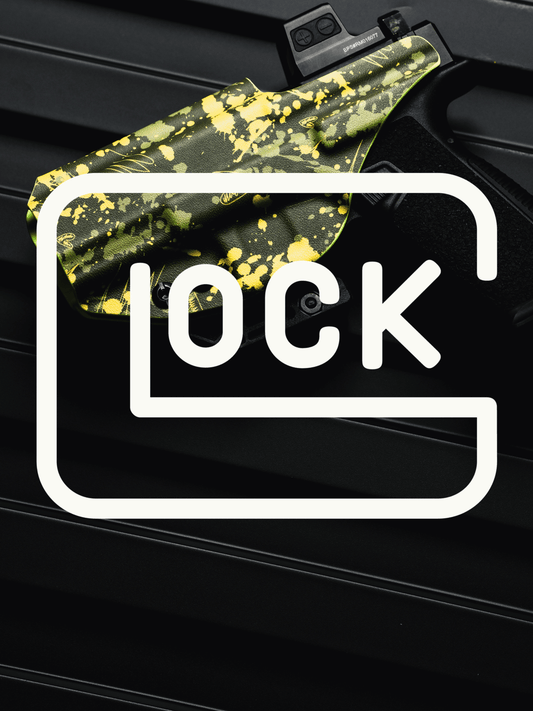 A close-up of a glock handgun resting on a black textured surface, with a bright yellow and dark green splatter-patterned holster or cover partially visible. A large white outlined logo with the word 'GLOCK' is overlaid across the center.